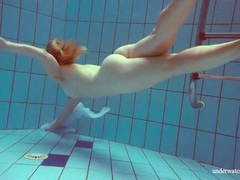ChiliMovies presents: Redhead goes for a nude swim in the pool